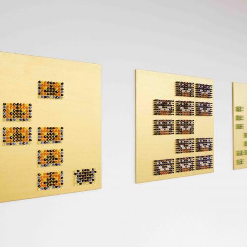 Mosaic representations of butterflies on a gold rectangular background
