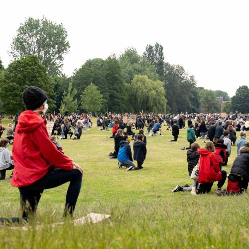 Protestors kneeling in Verulamium Park