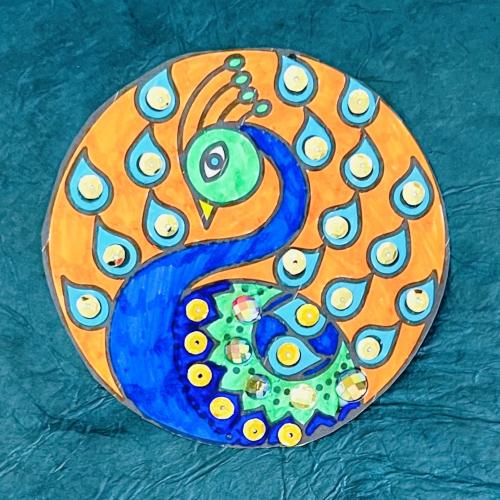 Rangoli pattern in the shape of a peacock