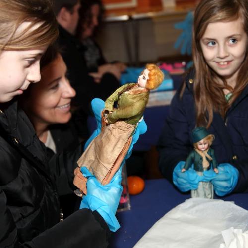 Photograph of a group looking at an object