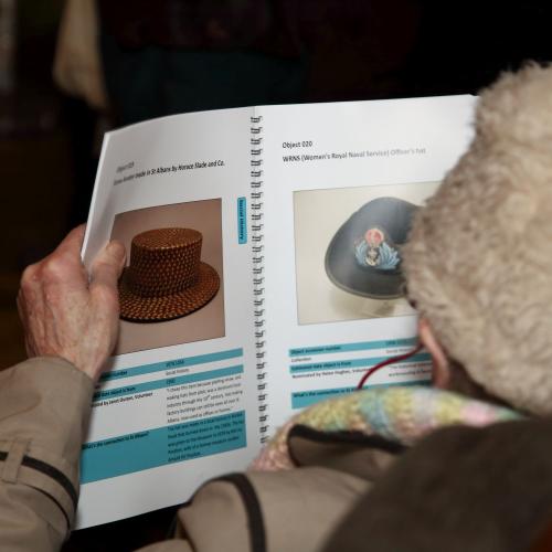 Photograph of someone looking at an object catalogue