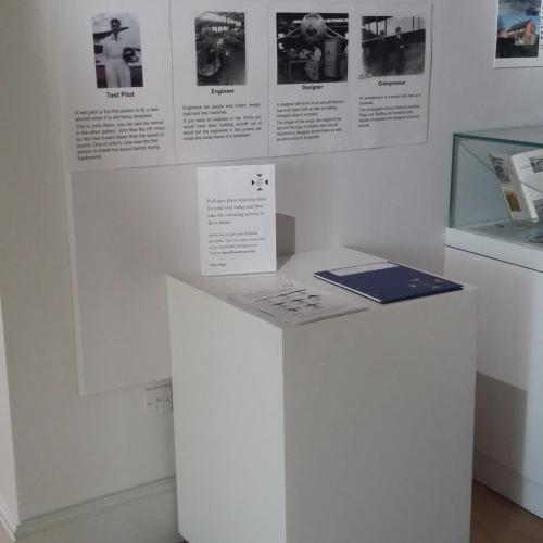 Handley Page exhibition showing a plinth with large text information and activity sheets for children (but no pencils)