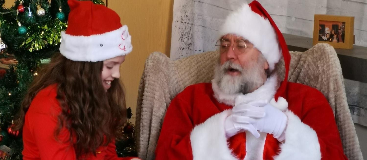 father christmas talking to elf
