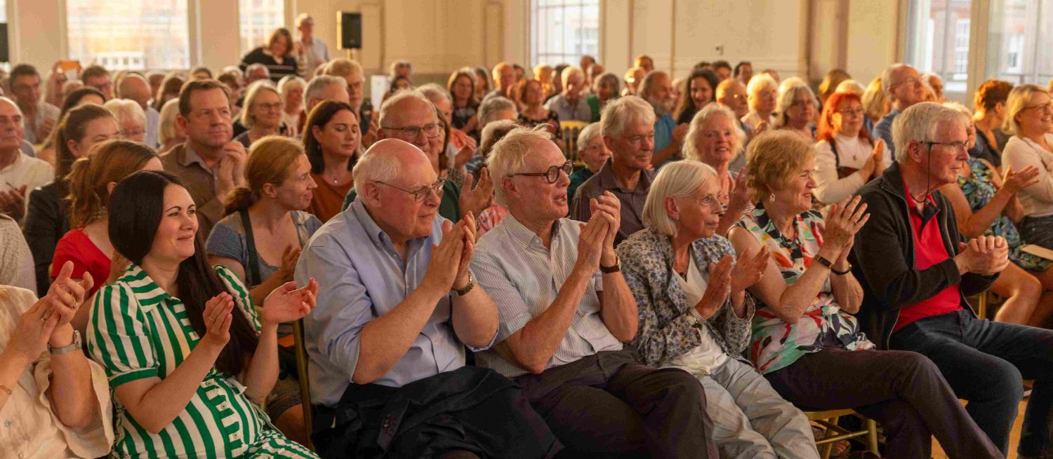 people clapping after a talk