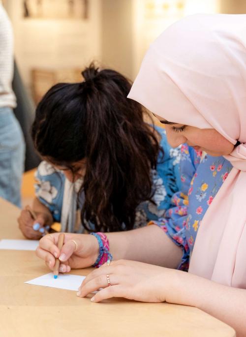 Two women drawing in the museum