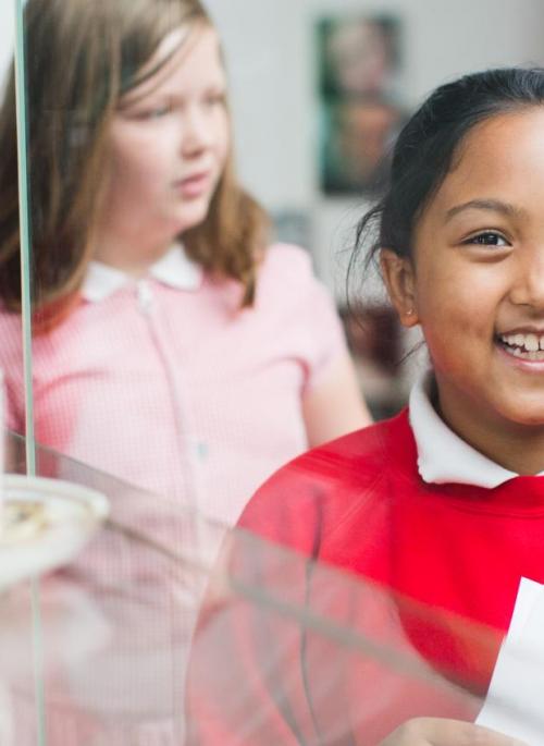 Girl smiling in museum gallery